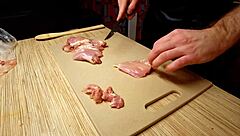 Naked gay chef cooks rice noodle with chicken and vegetables