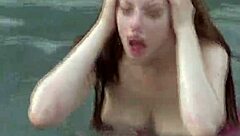 Misha Lowe flaunts massive tits by the pool