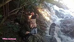 tiffany montavani and pitoco engage in outdoor waterfall sex, with pitoco pounding her pussy orally and fucking her tits