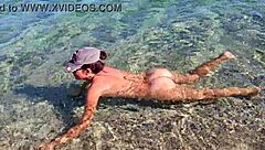 natural girl enjoys nudism on public beach