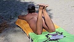 natural girl enjoys nudism on public beach