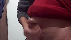 i'm jerking off with my clothes on, feeling the skinny cock in my hand as i masturbate alone.