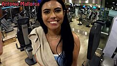 Brazilian woman works out hard in the gym