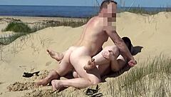 Assisting a juicy mature woman on the beach