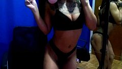 Anjinha poses sensually in front of the mirror while touching herself