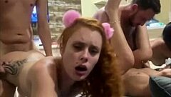 Three cute redhead teens and a wife engage in a wild FFM threesome on the sofa, with doggystyle and monster cocks