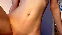 Petite teen 18+ reaches orgasm with dildo in tight pussy striptease solo session.