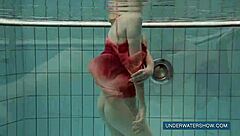 Katya feels free in red dress at pool.