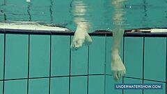 Katya feels free in red dress at pool.