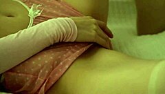 Lynn strips naked and rams a glass dildo deep in her dripping cunt, wow!