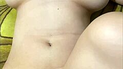 Is This Petite Pregnant Babe Teasing Her Fan on Cam with Close-Up Pussy Shots?