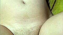 Is This Petite Pregnant Babe Teasing Her Fan on Cam with Close-Up Pussy Shots?