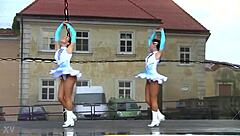 yo, check these two cute majorettes showing off their moves!