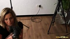 Redhead Mature Seductress Poses For Glasses-Wearing Male Model