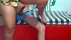 Passionate couple licks pussy in living room