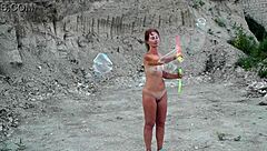 Soap bubbles outdoor adventure turns into a naked mature milf showcase. Watch her shine!