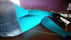 Milf with beautiful legs in pantyhose lies on desk