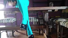 Milf with beautiful legs in pantyhose lies on desk