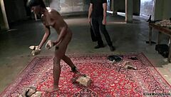 Ebony woman endures whipping and vibration.