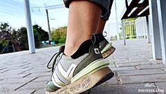 i tease my tan nylon soles in blue jeans on the bench outdoors