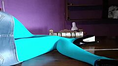 Milf with beautiful legs in pantyhose lies on desk