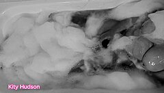 Kity hudson indulges in a steamy bath session with her favorite vibrator, reaching intense orgasms as her mature, hairy body responds eagerly.
