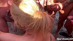 horny milf masturbates publicly at beach, receiving cumshots