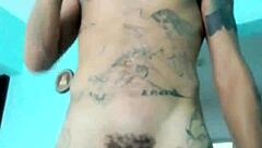 Skinny guy shows off his banana toy in the living room