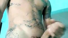 Skinny guy shows off his banana toy in the living room