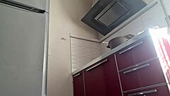 gostosa cozinhando in the kitchen, teasing with natural tits and pussy fetish.