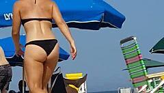 candid shots of this little 18+ slut's ass in a bikini at the beach, hidden from view