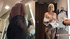 Busty blonde caught trying transparent clothes in dressing room POV!