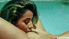 naughty girls lick each other by the pool