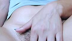Solo girl fingers her hairy pink pussy until legs shake in orgasm.