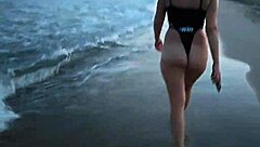 Blonde boldly flashes tits and sucks cock on public beach