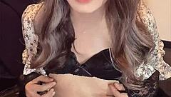 I filmed this beautiful asian ladyboy masturbating quietly in her one-piece dress.