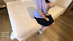 schoolgirl with trimmed pussy and buttplug dripping