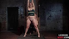 Femdom lezdom in lingerie fucks bound curvy ginger sub with dildo