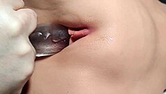 Shaved girl bored, using toys on her hairless pussy in close up fetish play