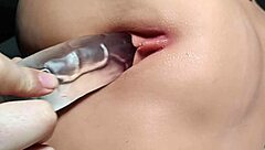 Shaved girl bored, using toys on her hairless pussy in close up fetish play