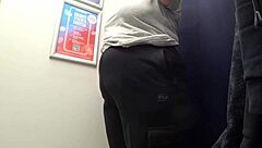Camera Catches Curvy MILF Changing Clothes in Fitting Room, Revealing Big Ass in Satin Panties