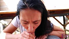 Housewife gives sloppy blowjob under table in backyard pov