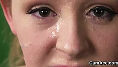 nasty looker gets cumshot on her face eating all the cream