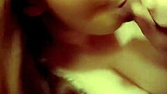 A redhead milf is sucking on a hard cock in a casual setting.