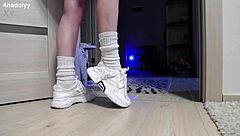 delicate legs in sneakers are waiting for you in the shower