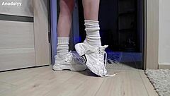 delicate legs in sneakers are waiting for you in the shower