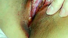 Horny Japanese slut rubs her wet cunt close up