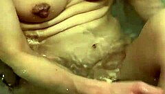 Wife washes body slowly in bath. I want to touch her nipples.