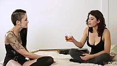 innocent brunette drinks whiskey with friend