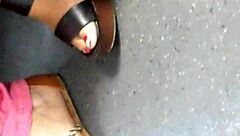 Mature Woman Hides Her Feet in Wedges and Sandals During Candid Moment